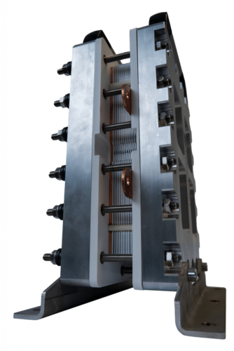 A side view of a metallic, multi-layered fuel cell stack with bolts and brackets attached. A side view of a metallic, multi-layered fuel cell stack with bolts and brackets attached.